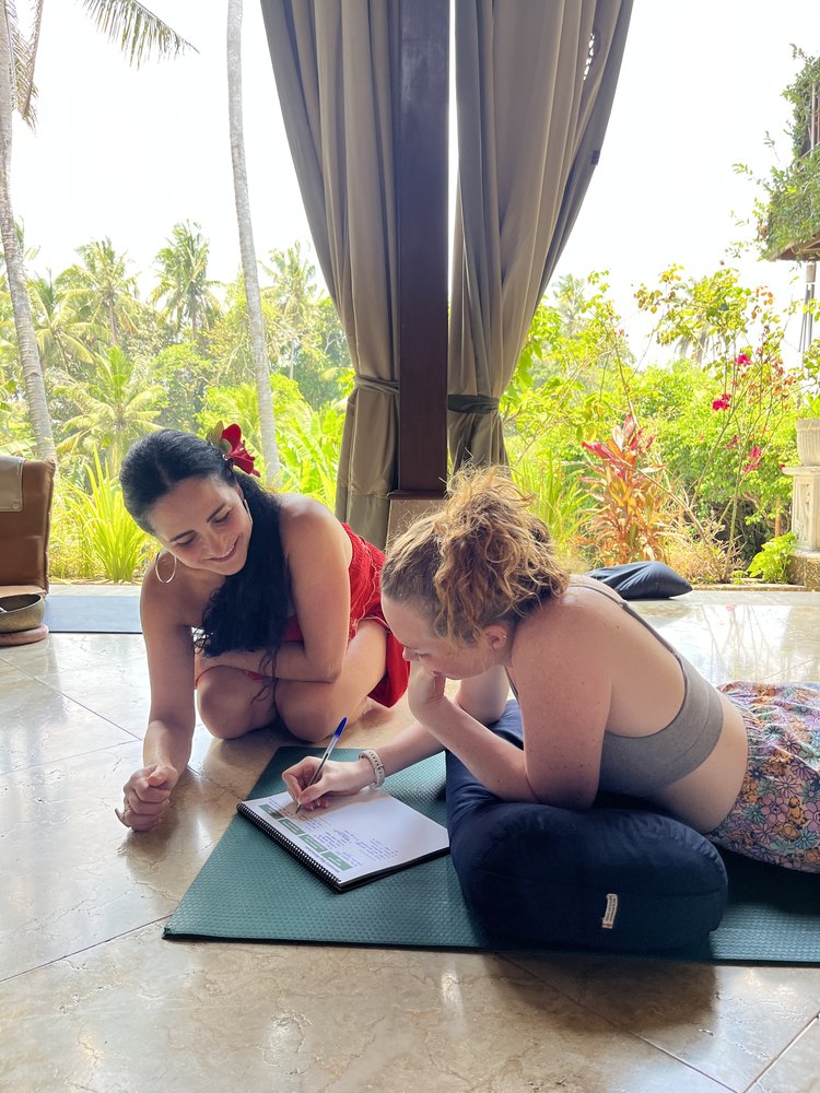 Two women working through the retreat workbook