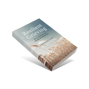The cover of the book 'Resilient Grieving'. There is a blue sky above and a wheat field below.