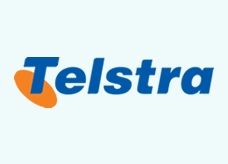 The Telstra logo with the name of the organisation in blue and an orange ellipse behind the first 'T' of Telstra.