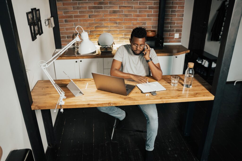 man working at a desk from home