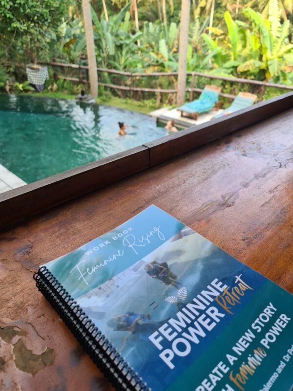 Feminine Power Retreat workbook and pool area