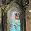 woman in the pool under arches at Retreat venue in Bali